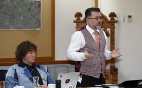 Councillor Vince Cocurullo (standing) speaks against his council voting for Māori seats at its November meeting.