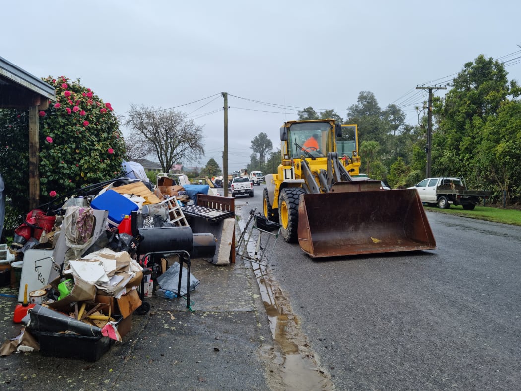 The New Zealand Defence Force, Buller District Council staff and Westreef contractors are working together to remove flood damaged items from homes in Westport.