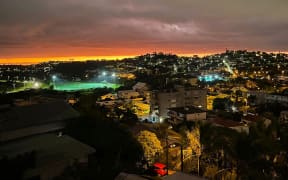 An aerial view of Nouméa by night