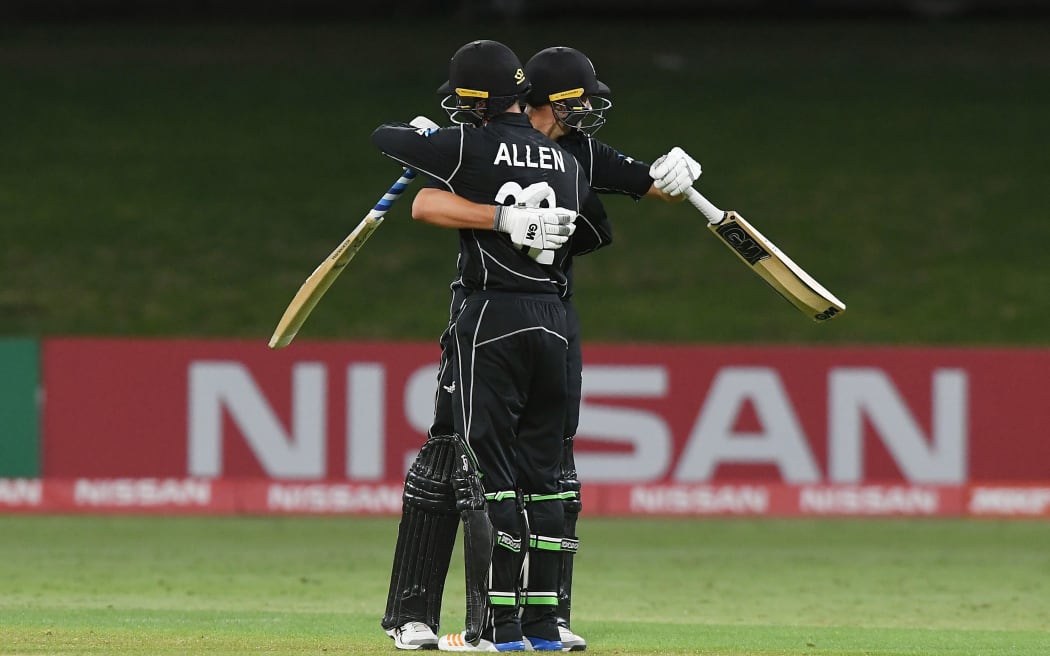New Zealand's Finn Allen and Kaylum Boshier celebrate winning the Under 19 Cricket World Cup match against the West Indies.