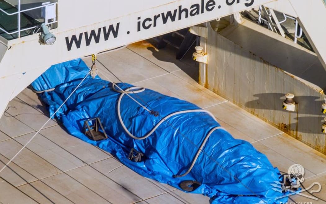 The group said the Japanese crew quickly covered the whale with a tarpaulin.