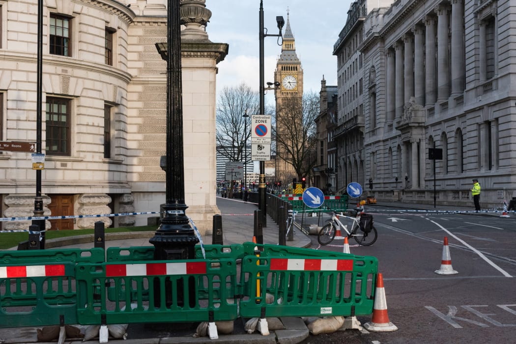 Police take security measures near Parliament square in Westminster, London after a man drove through pedestrians and stabbed a police officer.