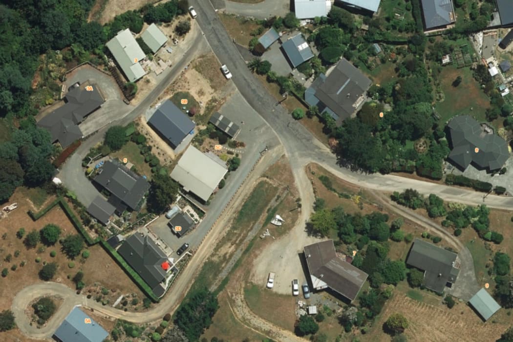 An aerial shot of properties in Havelock shows the differences in grass colours.