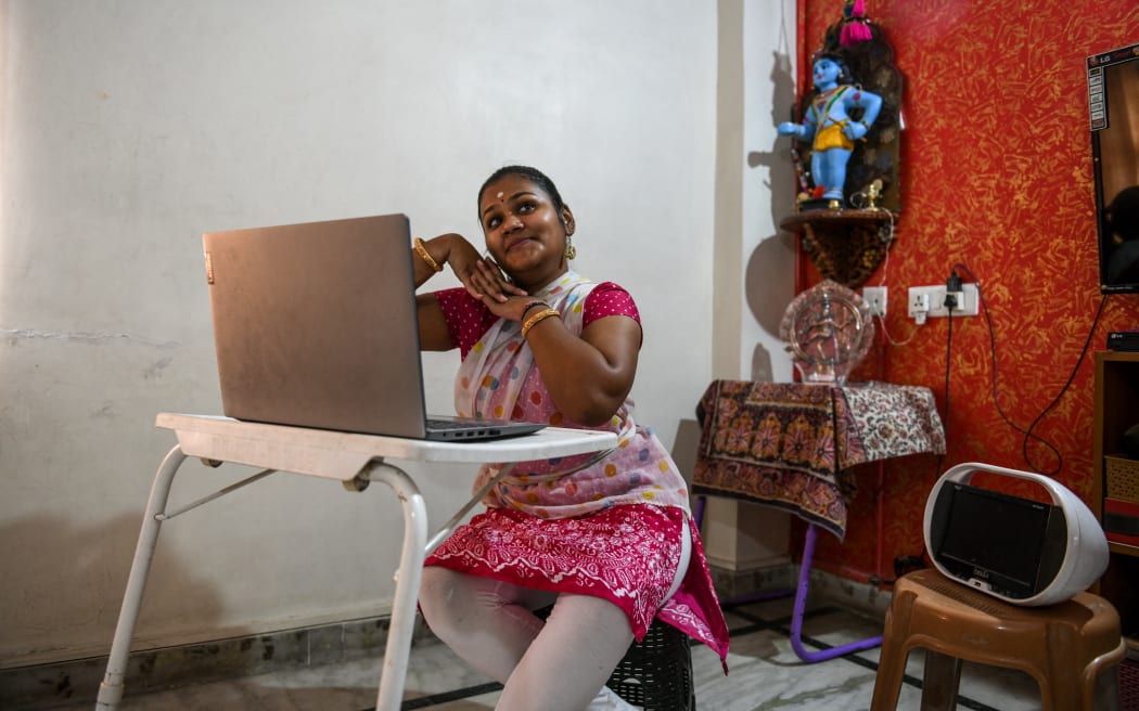 Classical dancer Anisha Srinivas performs 'Abhinaya', the Indian art of expression, as she teaches online classes at her home in Hyderabad on August 1, 2020. (Photo by NOAH SEELAM / AFP)