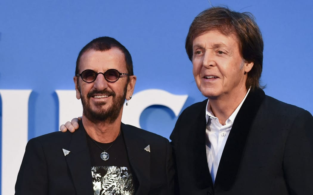 British singer-songwriter Paul McCartney (R) and muscian Ringo Starr (L) of legendary rock-band The Beatles pose arriving on the carpet to attend a special screening of the film "The Beatles Eight Days A Week: The Touring Years" in London on September 15, 2016.