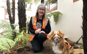 Debbie Bishop with New Zealand's first frog detection dog Holly.