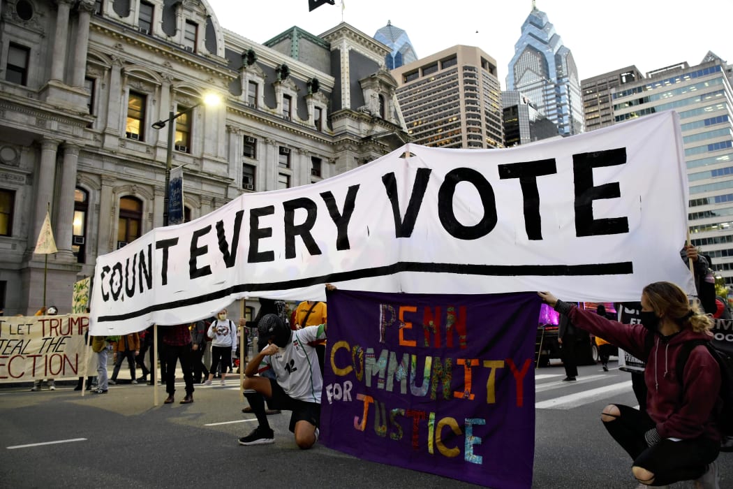 People demand that every vote of the US  presidential election is counted, during a rally in Philadelphia, Pennsylvania.