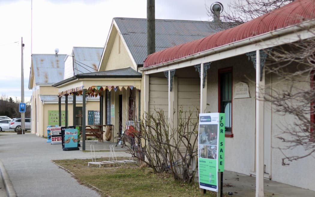 A view down Oturehua’s main street, with Gilchrist’s Store and adjoining house in the foreground.