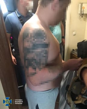 A man is arrested by the Ukranian secret service after raids on neo-Nazis in the area who were reportedly inspired by the Christchurch mosque attacker.