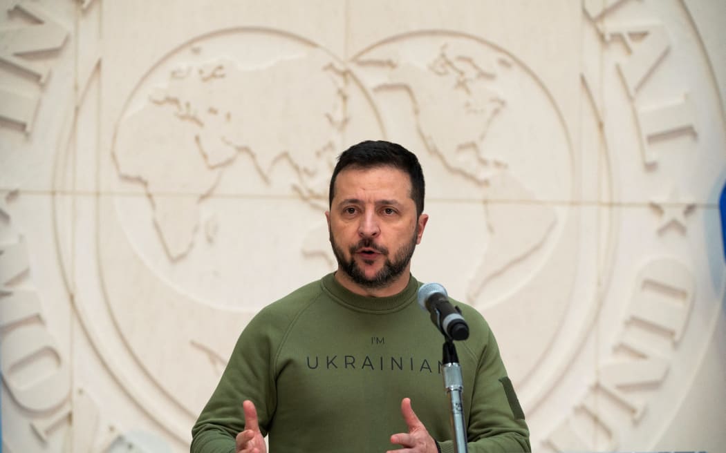 Ukrainian President Volodymyr Zelensky speaks to the press after he met with International Monetary Fund (IMF) Director Kristalina Georgieva at IMF headquarters in Washington, DC, on December 11, 2023.