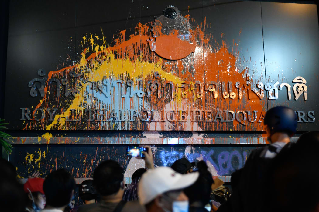 A banner of the Royal Thai Police Headquarters was spray-painted by protesters during an anti-government rally outside the Royal Thai Police Headquarters in Bangkok, Thailand.