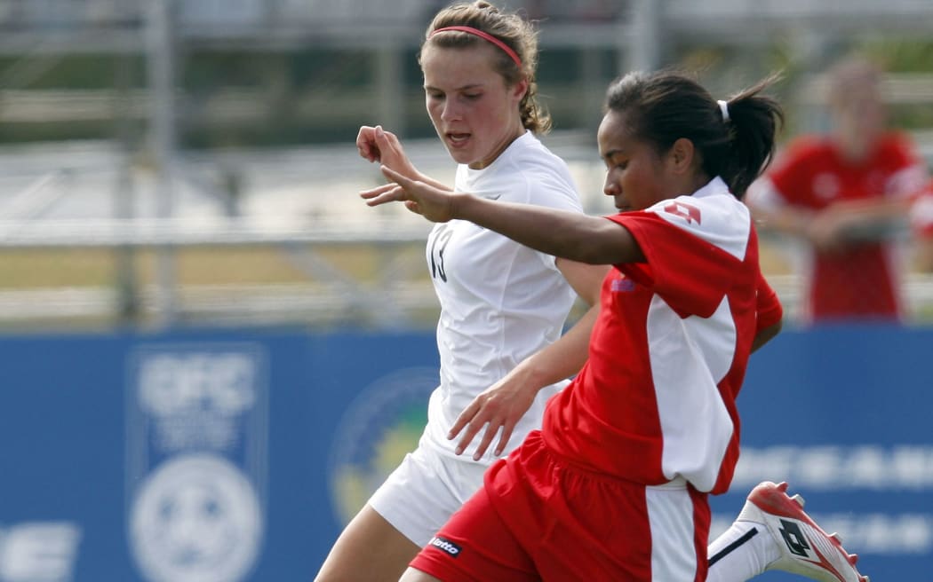Penateti Feke, (in red), in action against NZ in 2010.