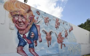 Mural "When Pigs Fly" by Miami artists Rei Ramirez and Ivan Roque.