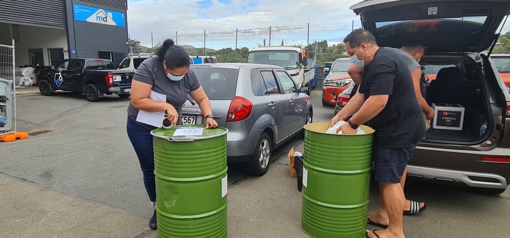 This family is packing their drums for family in Kolomotu'a
