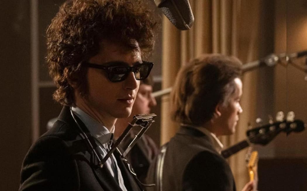 Timothée Chalamet as Bob Dylan in A Complete Unknown.