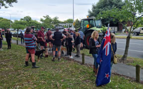 Protesters gather in Christchurch Sunday.