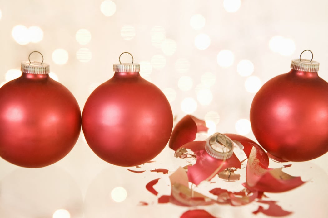 A broken christmas bauble between others (Photo by Carlos Hernandez / Connect Images / Connect Images via AFP)