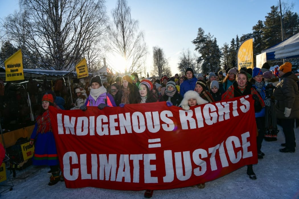 Climate activist Greta Thunberg marches beside members of the indigenous Sami community during a protest in Sweden.