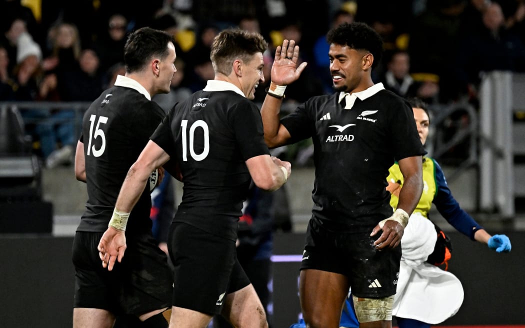 Will Jordan of New Zealand celebrates a try.