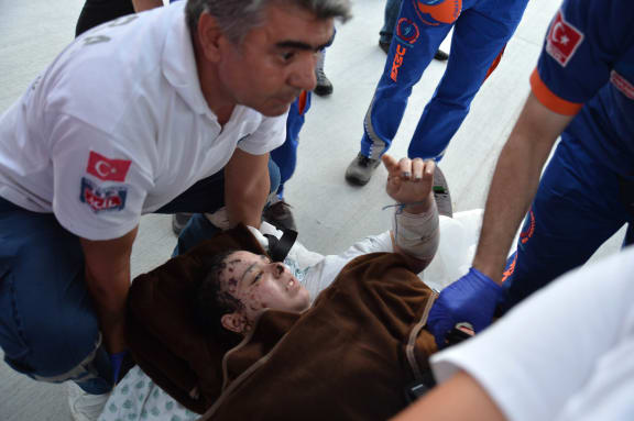 A Palestinian girl injured during the Israeli bombing of Gaza arrives in Turkey.