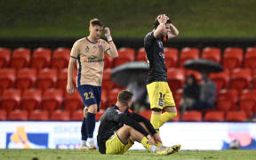 Alex Rufer of the Phoenix (right) reacts following their draw in the A-League Men Round 25 match between the Newcastle Jets and the Wellington Phoenix.