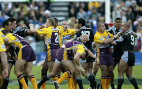 A fight breaks out between Warriors and Broncos players during the round 24 NRL match between the Warriors and the Brisbane Broncos at Ericsson Stadium on August 24, 2003