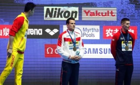 Chinese swimmer Sun Yang has words with Briton Duncan Scott after extraordinary scenes following the 200m freestyle final at the world champs in Gwangju.