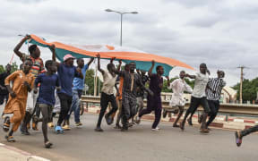 Supporters of Niger's National Council for the Safeguard of the Homeland (CNSP) gather for a demonstration in Niamey on August 11, 2023 near a French airbase in Niger.