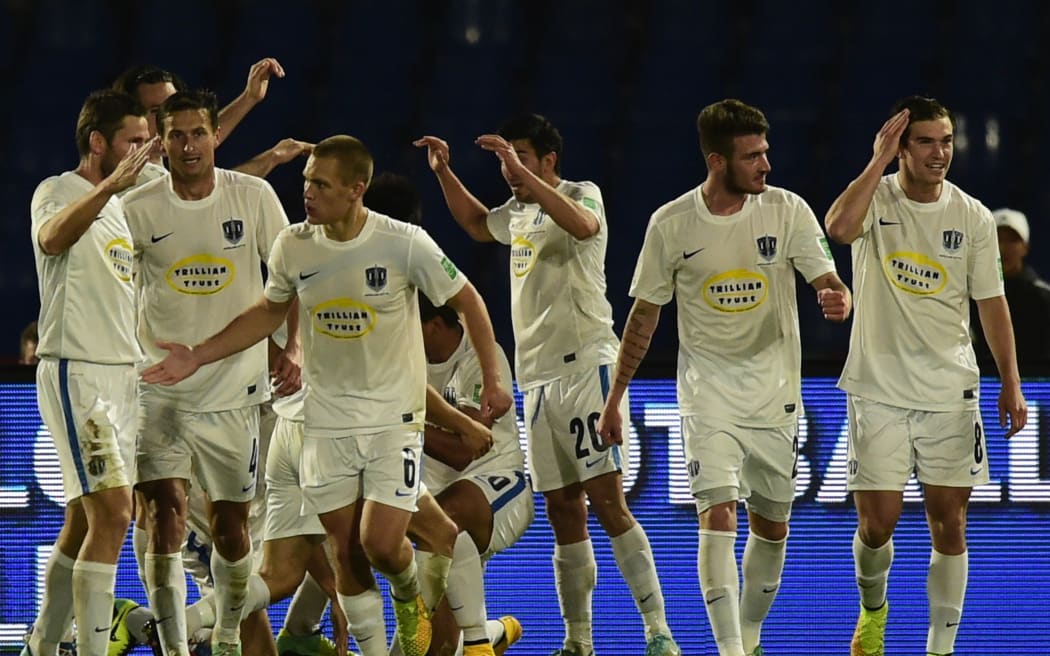 Auckland City players celebrate their goal against San Lorenzo.