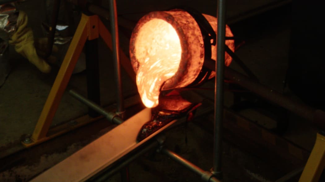 Molten lava starting to pour out of the crucible in the Lava Lab.
