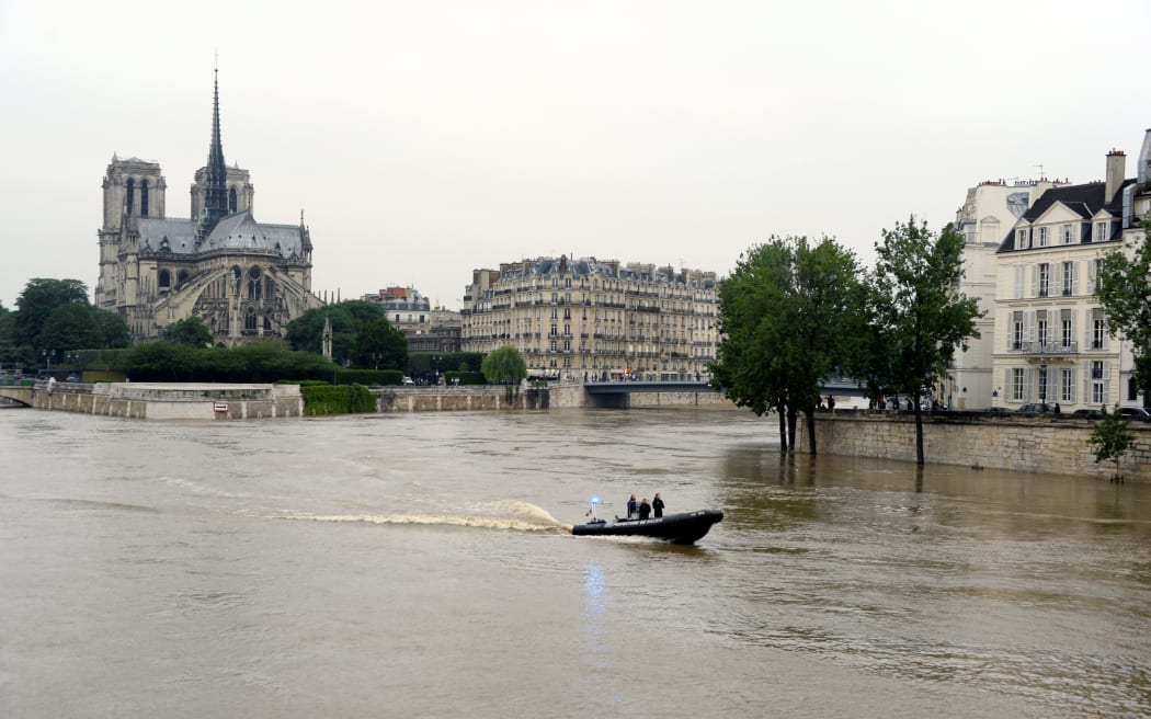 Flooded banks of the river Seine in Paris, as torrential downpours and flooding lashes parts of northern Europe leaving at least 15 dead.