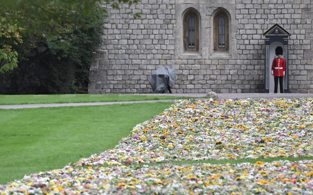 A member of the Coldstream Guards stands guard at Windsor Castle, west of London, on 15 September, 2022, following the death of Queen Elizabeth II on 8 September.