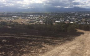 The damage from the recent blazes can be seen clearly on the hills above Blenheim.