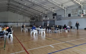 People at the Rodney Green evacuation centre in Napier after Cyclone Gabrielle hit Hawke's Bay.