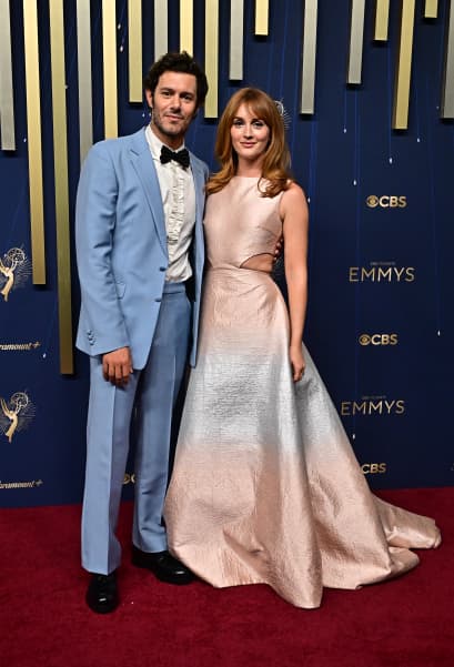 US actor Adam Brody (L) and wife US actress Leighton Meester arrive for the 77th Primetime Emmy Awards at the Peacock Theatre at LA Live in Los Angeles on September 14, 2025. (Photo by Frederic J. Brown / AFP) / RESTRICTED TO EDITORIAL USE