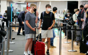Passengers at Auckland Airport as the Covid-19 regional boundary was lifted on 15 December.