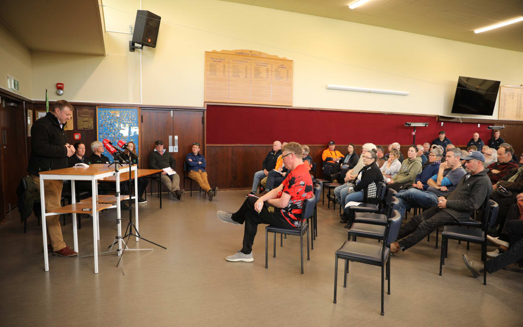 The community listening to Mark Patterson speak at Simpson Park hall in Lawrence, Otago - 29 October 2025