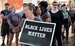 Demonstrators march through the West County Mall protesting the acquittal of former St Louis police officer Jason Stockley.