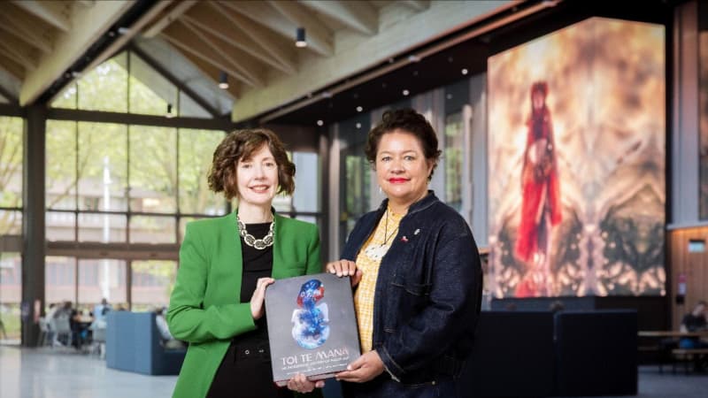 Deidre Brown and Ngarino Ellis. Background artwork _Māramatanga_ by Lisa Reihana. Photo by Chris Loufte.