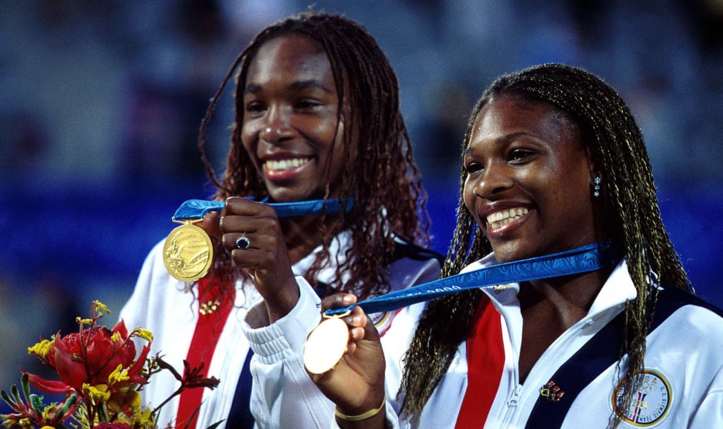 Serena and Venus Williams of USA on the podium with their gold medals for the Womens Doubles Tennis at the Sydney Olympics 2000.
