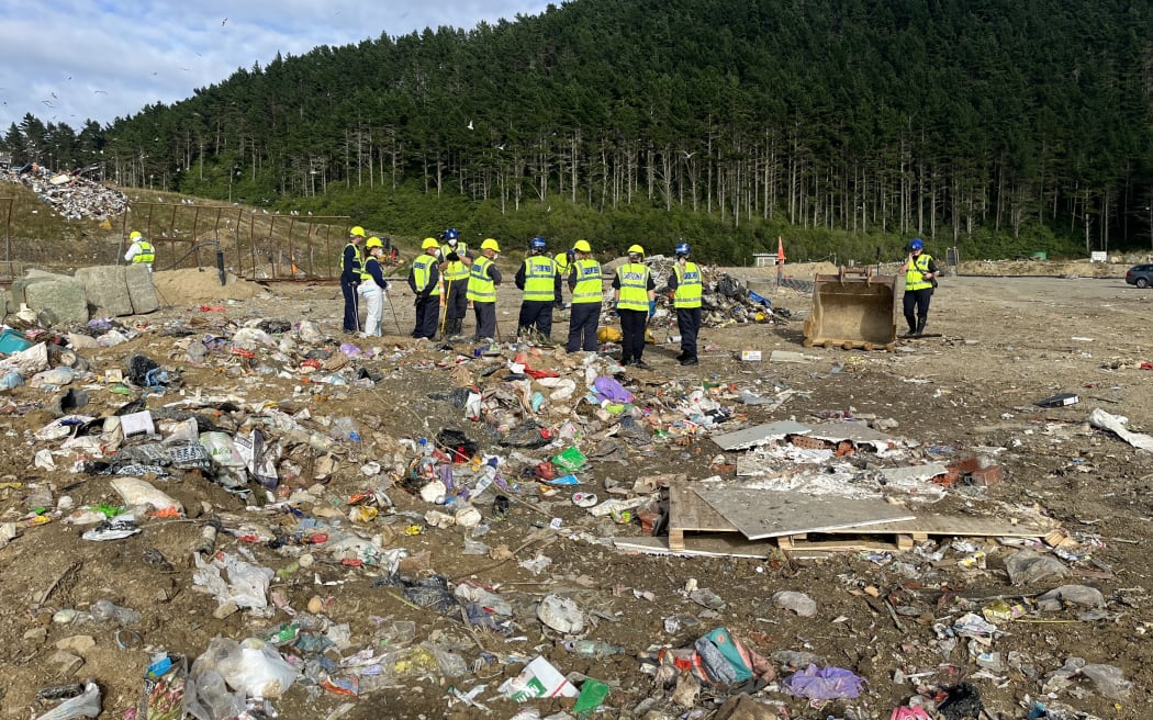 Police search a landfill in Porirua on 9 February, 2024, as part of a homicide investigation after the death of an elderly woman in the Wellington suburb of Khandallah in January.