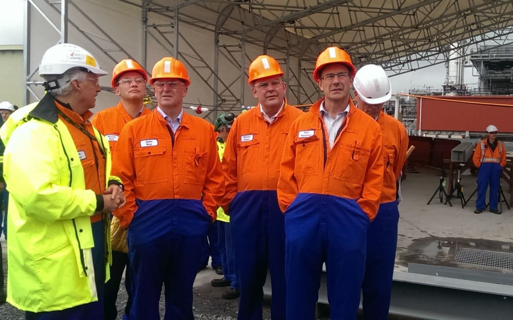 National leader John Key, third left, visiting Marsden Point refinery today.