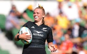 Jorja Miller of New Zealand scores a try.