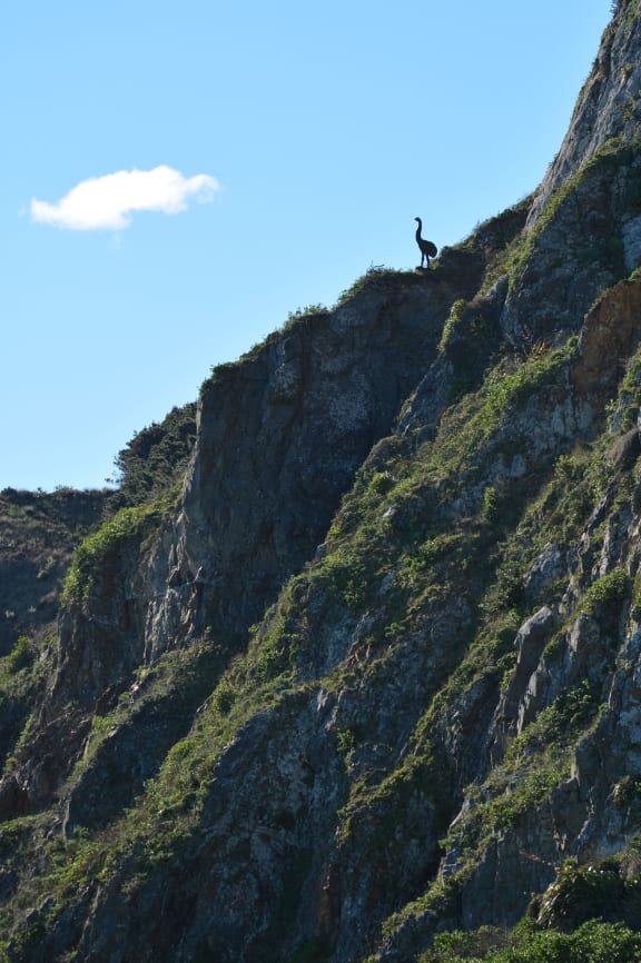 Cliff the Moa stares out from his perch on the hillside above Moa Point.
