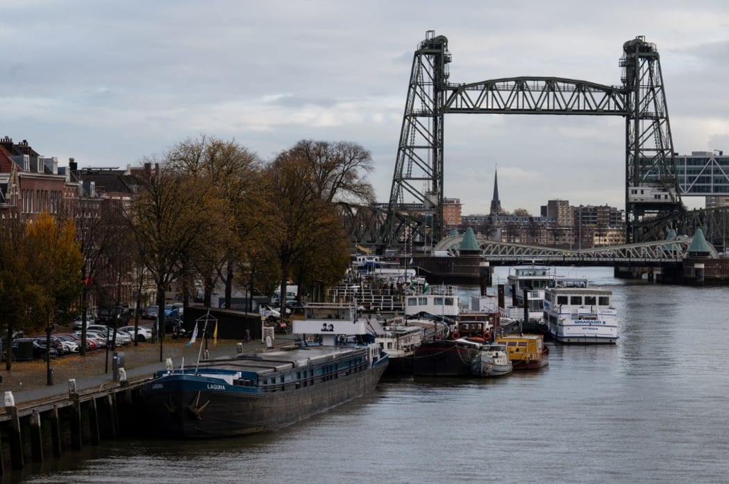 The Koningshavenbrug 'De Hef" lift bridge (R, rear) and the Koninginnebrug drawbridge (R, front) are seen in the background in Rotterdam, western Netherlands, on 23 November, 2021.