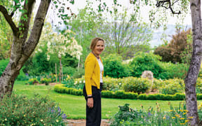 Jane Falconer standing in the Clachanburn Country Garden, on her farm in Patearoa, Central Otago.