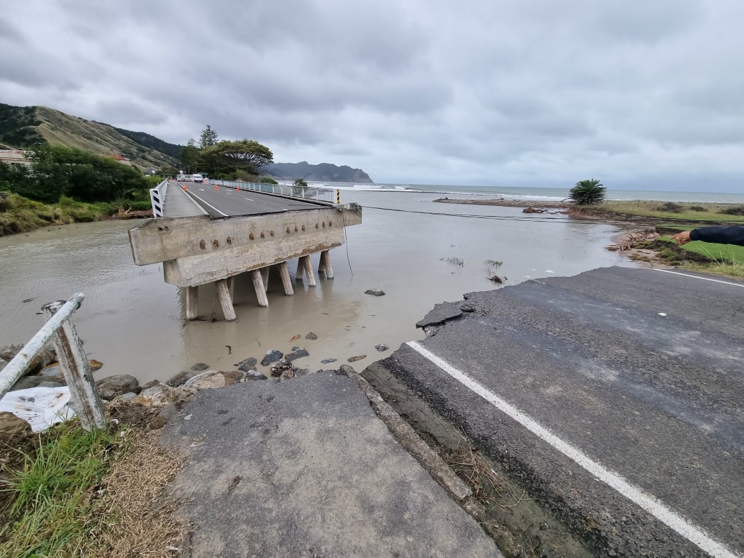 A bridge on the main highway has been ripped in half, tearing the town of Tokomaru Bay in two, with no way to get across instead of swimming, using a horse or getting special vehicles.