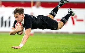 New Zealand's Ruben Love scores a try during the rugby union test match between New Zealand and Japan at Nissan Stadium in Yokohama, Kanagawa prefecture, south of Tokyo on October 26, 2024. (Photo by Philip FONG / AFP)