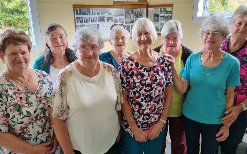 Members of the Tarata Women's Institute stand together. Front centre, left to right, June Pawley and Margaret Leak.
