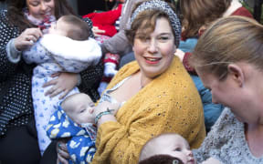 Demonstrators feed their babies during a protest in support of breastfeeding in public outside Claridge's hotel in London.